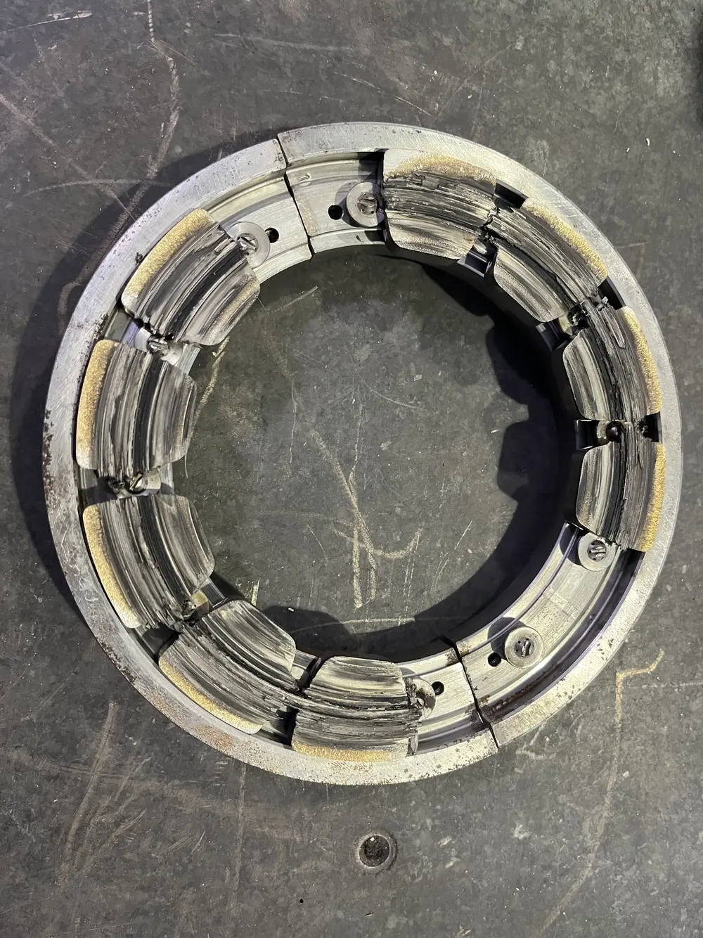 Failed tilting pad thrust bearing as received