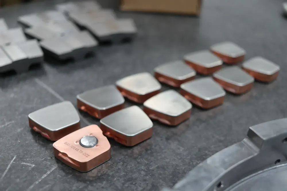 Detail of upgraded thrust bearing pads and carrier